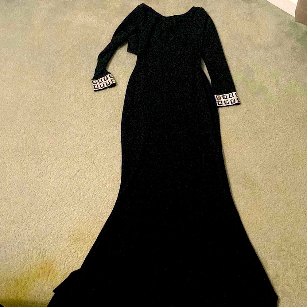 - Black fitted dress/gown! Open the back all the way to the lower bac…